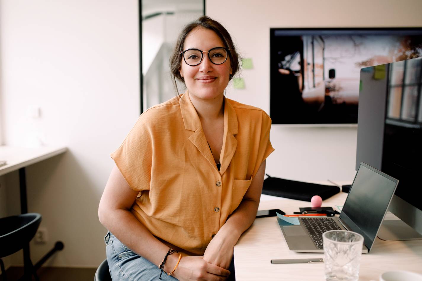 Woman smiling at desk