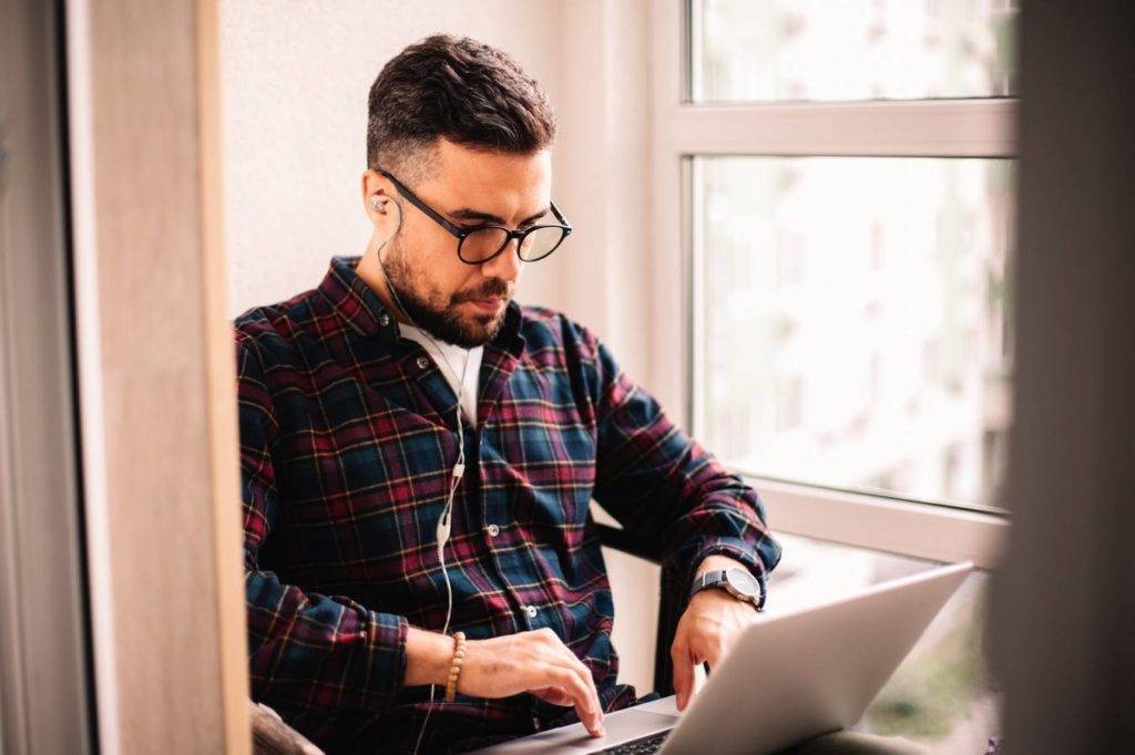 Man looking at his laptop