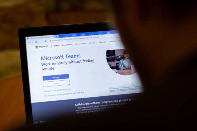 A person reading on his desktop about Microsoft Teams